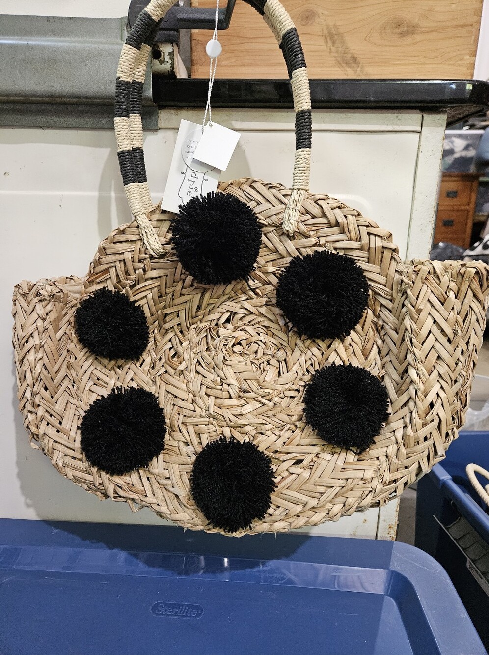 Woven Straw Tote with Black Pom-Pom Accents